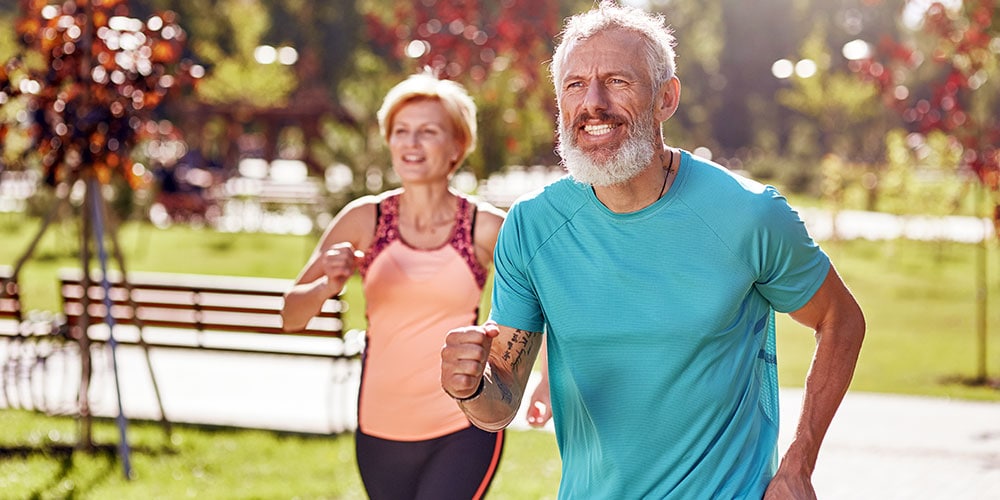 Happy running middle age couple