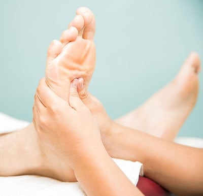Person receiving a foot massage