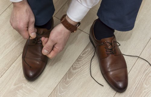 Man trying on leather dress shoes